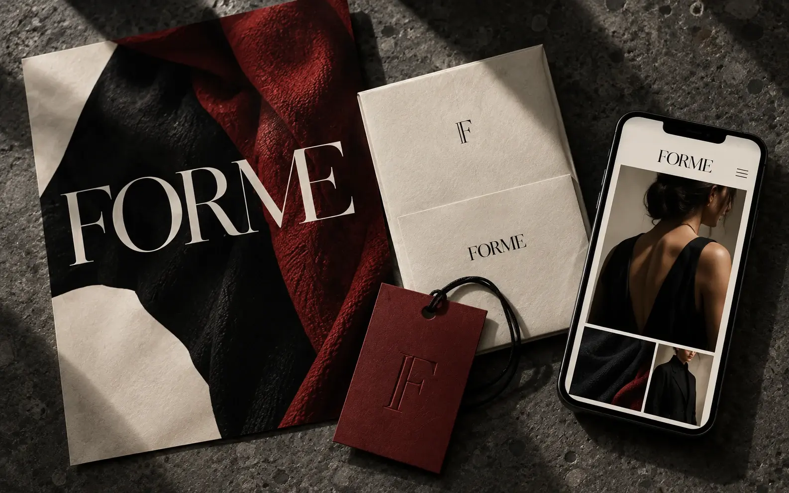FORME concept: bone, black and oxblood identity across a poster, packaging, an embossed garment tag and a mobile storefront.